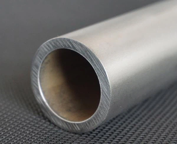 Zirconium clad steel pipe